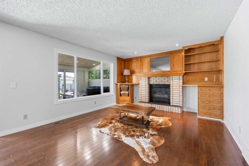 73 Riverview Close Se, Calgary, AB - Indoor Photo Showing Living Room With Fireplace