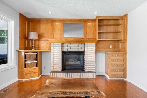 73 Riverview Close Se, Calgary, AB - Indoor Photo Showing Living Room With Fireplace