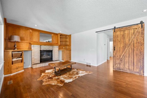 73 Riverview Close Se, Calgary, AB - Indoor Photo Showing Living Room With Fireplace