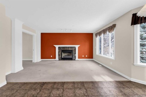 155 Lakeview Cove, Chestermere, AB - Indoor Photo Showing Other Room With Fireplace