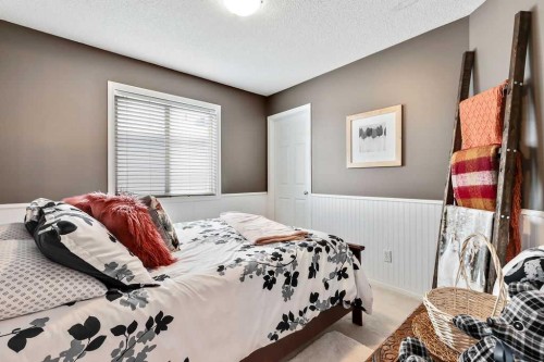 155 Cimarron Grove Circle, Okotoks, AB - Indoor Photo Showing Bedroom