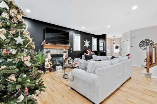 155 Cimarron Grove Circle, Okotoks, AB - Indoor Photo Showing Living Room With Fireplace