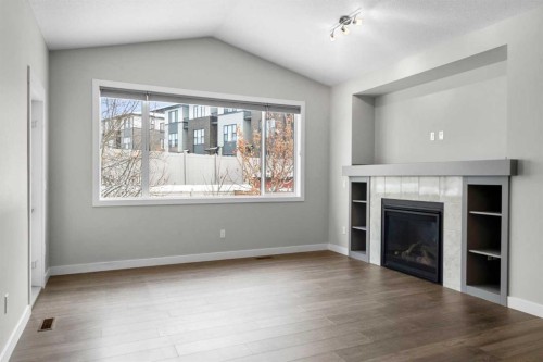 136 Drake Landing Gardens, Okotoks, AB - Indoor Photo Showing Living Room With Fireplace