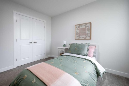 83 Saddlebred Place, Cochrane, AB - Indoor Photo Showing Bedroom