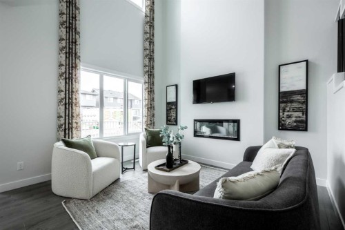 83 Saddlebred Place, Cochrane, AB - Indoor Photo Showing Living Room With Fireplace