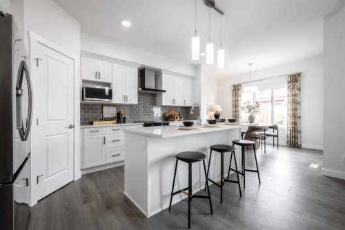 83 Saddlebred Place, Cochrane, AB - Indoor Photo Showing Kitchen With Upgraded Kitchen