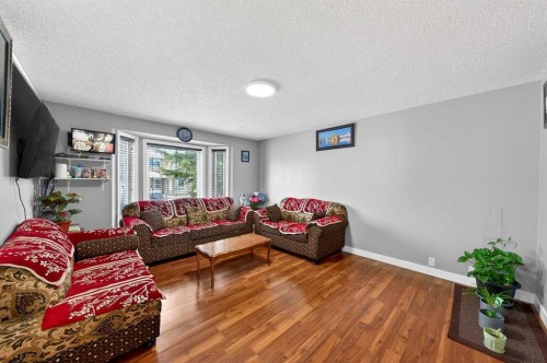 214 Martinwood Place Ne, Calgary, AB - Indoor Photo Showing Living Room
