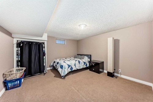 343 Deer Side Place Se, Calgary, AB - Indoor Photo Showing Bedroom