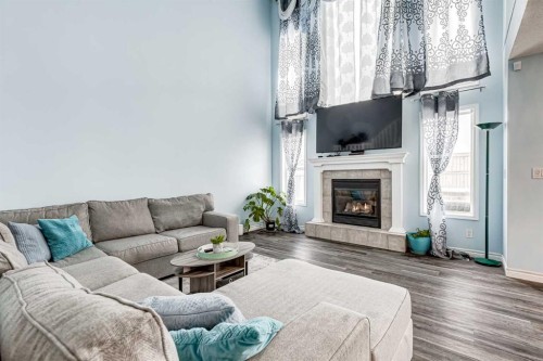 94 New Brighton Circle Se, Calgary, AB - Indoor Photo Showing Living Room With Fireplace