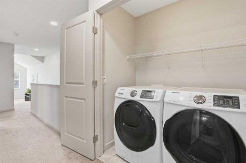 91 Evanscrest Way Nw, Calgary, AB - Indoor Photo Showing Laundry Room