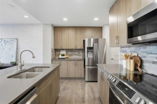 91 Evanscrest Way Nw, Calgary, AB - Indoor Photo Showing Kitchen With Double Sink With Upgraded Kitchen