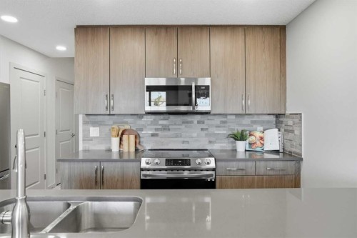 91 Evanscrest Way Nw, Calgary, AB - Indoor Photo Showing Kitchen With Double Sink