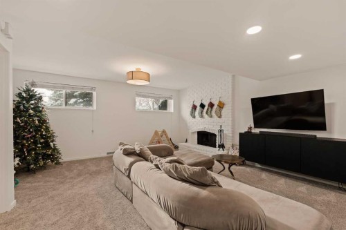 212 Vantage Place Nw, Calgary, AB - Indoor Photo Showing Living Room With Fireplace
