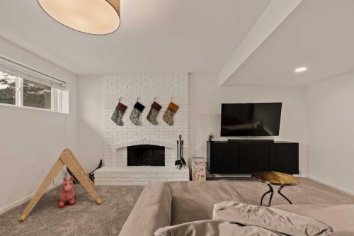 212 Vantage Place Nw, Calgary, AB - Indoor Photo Showing Other Room With Fireplace
