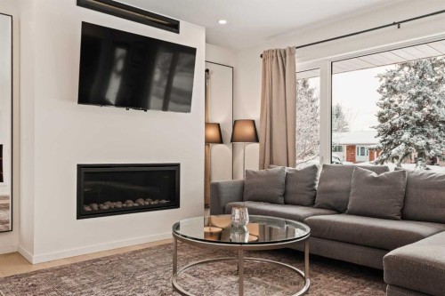 212 Vantage Place Nw, Calgary, AB - Indoor Photo Showing Living Room With Fireplace