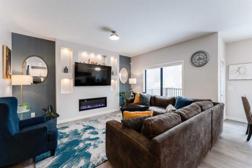 1425 Chinook Gate Glen Sw, Airdrie, AB - Indoor Photo Showing Living Room With Fireplace