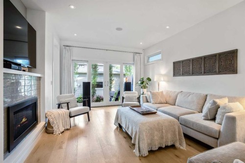 2136 53 Avenue Sw, Calgary, AB - Indoor Photo Showing Living Room With Fireplace