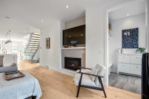 2136 53 Avenue Sw, Calgary, AB - Indoor Photo Showing Living Room With Fireplace