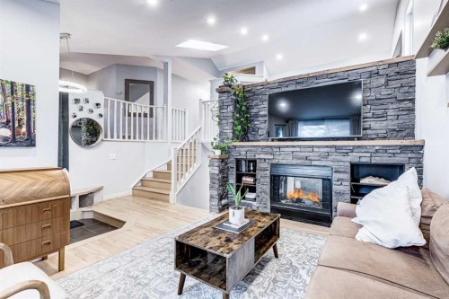 412 Mckerrell Place Se, Calgary, AB - Indoor Photo Showing Living Room With Fireplace