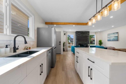 966 Berkley Drive Nw, Calgary, AB - Indoor Photo Showing Kitchen With Double Sink