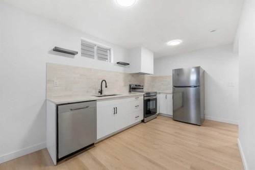 966 Berkley Drive Nw, Calgary, AB - Indoor Photo Showing Kitchen With Stainless Steel Kitchen