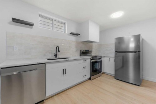 966 Berkley Drive Nw, Calgary, AB - Indoor Photo Showing Kitchen With Stainless Steel Kitchen With Upgraded Kitchen