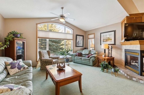 123 Whispering Way, Vulcan, AB - Indoor Photo Showing Living Room With Fireplace