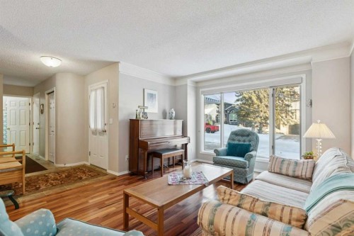 201-132 Straddock Crescent Sw, Calgary, AB - Indoor Photo Showing Living Room