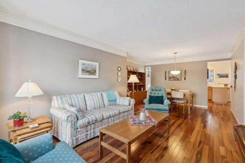 201-132 Straddock Crescent Sw, Calgary, AB - Indoor Photo Showing Living Room
