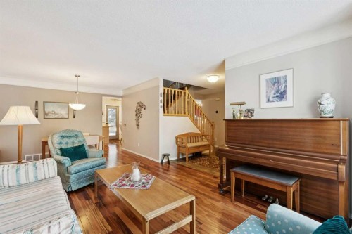 201-132 Straddock Crescent Sw, Calgary, AB - Indoor Photo Showing Living Room