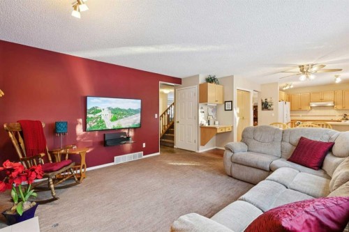 201-132 Straddock Crescent Sw, Calgary, AB - Indoor Photo Showing Living Room