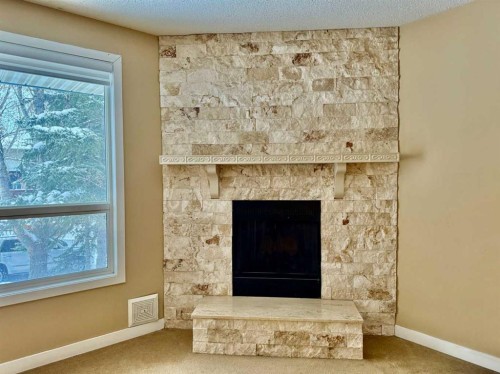 439 Ranchview Court Nw, Calgary, AB - Indoor Photo Showing Living Room With Fireplace