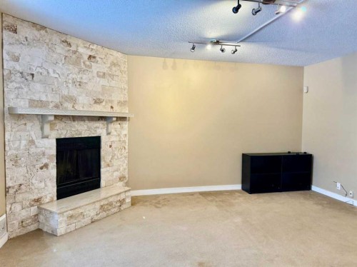 439 Ranchview Court Nw, Calgary, AB - Indoor Photo Showing Living Room With Fireplace