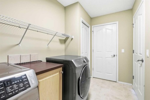 202 Panamount Court Nw, Calgary, AB - Indoor Photo Showing Laundry Room