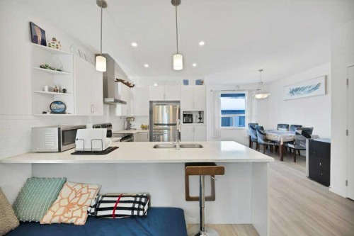 117 South Point Sw, Airdrie, AB - Indoor Photo Showing Kitchen With Double Sink With Upgraded Kitchen