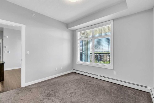 2409-3727 Sage Hill Drive Nw, Calgary, AB - Indoor Photo Showing Other Room