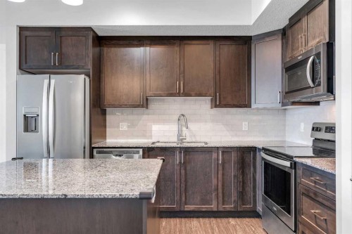 2409-3727 Sage Hill Drive Nw, Calgary, AB - Indoor Photo Showing Kitchen With Stainless Steel Kitchen With Upgraded Kitchen