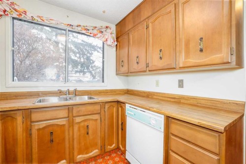 6404 24 Avenue Ne, Calgary, AB - Indoor Photo Showing Kitchen With Double Sink