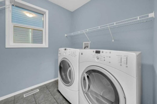 1174 Kingston Crescent Se, Airdrie, AB - Indoor Photo Showing Laundry Room