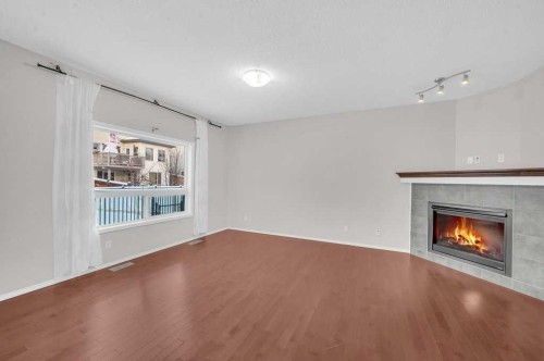 1174 Kingston Crescent Se, Airdrie, AB - Indoor With Fireplace