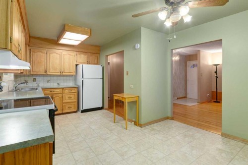 7404 Farrell Road Se, Calgary, AB - Indoor Photo Showing Kitchen With Double Sink