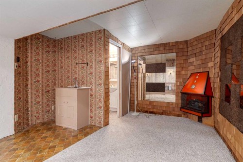 7404 Farrell Road Se, Calgary, AB - Indoor Photo Showing Other Room With Fireplace