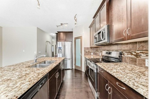 6 Evanspark Manor Nw, Calgary, AB - Indoor Photo Showing Kitchen With Double Sink With Upgraded Kitchen