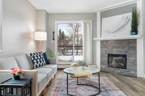 105-220 26 Avenue Sw, Calgary, AB - Indoor Photo Showing Living Room With Fireplace