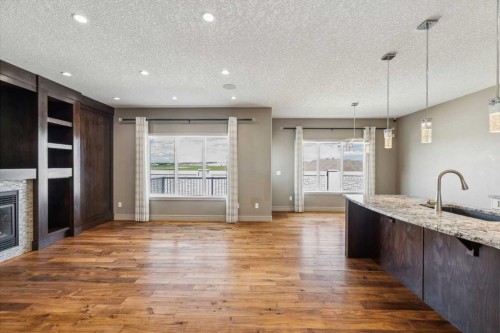152 Evansborough Way Nw, Calgary, AB - Indoor Photo Showing Kitchen With Fireplace