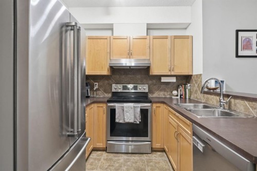 4311-70 Panamount Drive Nw, Calgary, AB - Indoor Photo Showing Kitchen With Stainless Steel Kitchen With Double Sink