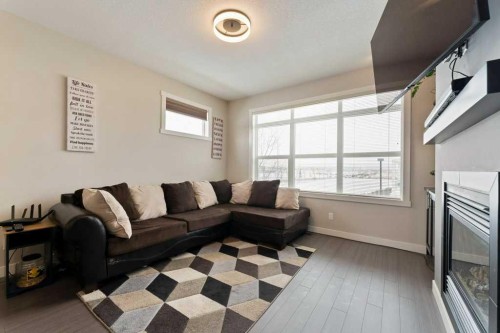 154 Redstone View Ne, Calgary, AB - Indoor Photo Showing Living Room With Fireplace
