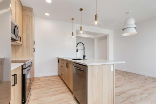 201 Tillotson Drive, Okotoks, AB - Indoor Photo Showing Kitchen With Upgraded Kitchen