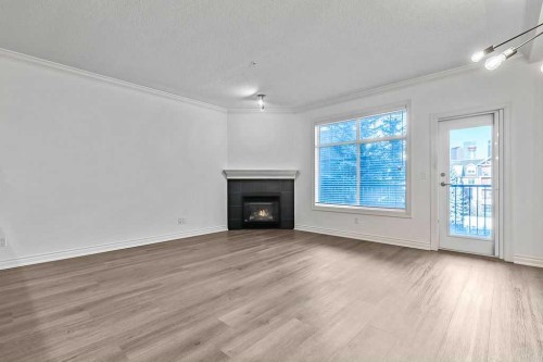411-60 24 Avenue Sw, Calgary, AB - Indoor Photo Showing Living Room With Fireplace