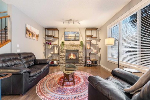4 Crestridge Way Sw, Calgary, AB - Indoor Photo Showing Living Room With Fireplace